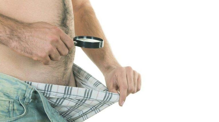 a man looks at his underpants and thinks about penis enlargement with soda